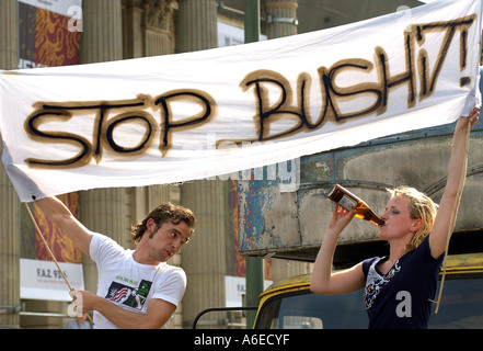 Young couple demonstrates against George W. Bush, Berlin Stock Photo