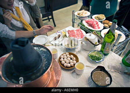 CHINA BEIJING Fresh ingredients including live shrimp for Mongolian hotpot meal with a variety of food and condiments Stock Photo