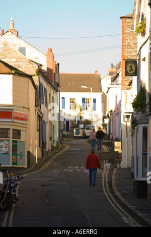 People taking an early morning stroll along the streets of Padstow.  Cornwall. UK. Stock Photo