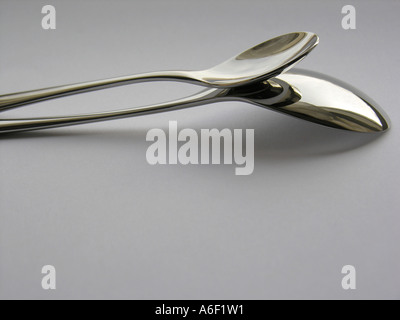 Two steel spoons Stock Photo