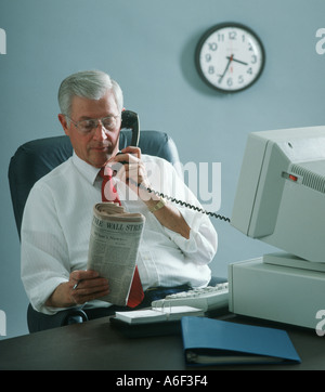 male executive talking on phone in office Stock Photo
