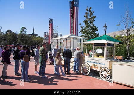 Tourists queuing at a popcorn stall, EPCOT Center, World Showcase, Disney World, Orlando, Florida, USA Stock Photo