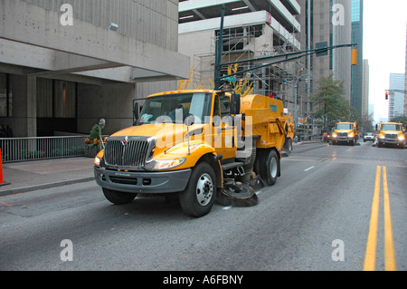 city and county of Fulton Street Sweepers cleaning up following an event in the city of Atlanta Georgia USA Veterans Vets day Stock Photo