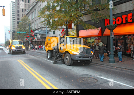 city and county of Fulton Street Sweepers cleaning up following an event in the city of Atlanta Georgia USA Veterans Vets day Stock Photo