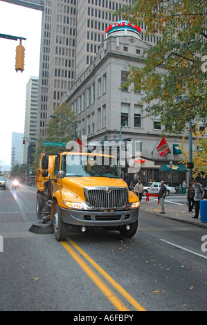 city and county of Fulton Street Sweepers cleaning up following an event in the city of Atlanta Georgia USA Veterans Vets day Stock Photo