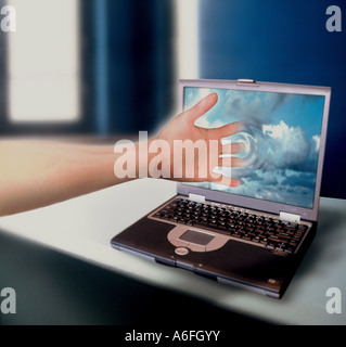 Hand passes into the internet world Stock Photo