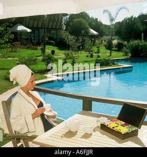 Woman relaxes with tea on vacation Stock Photo