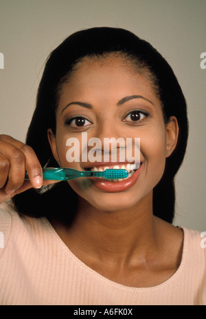 Woman brushing teeth Stock Photo