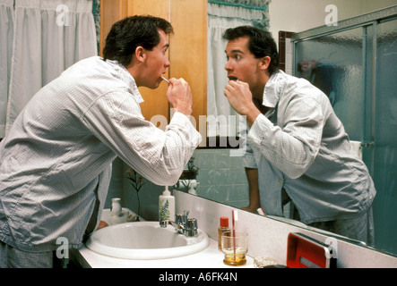Man brushing teeth Stock Photo