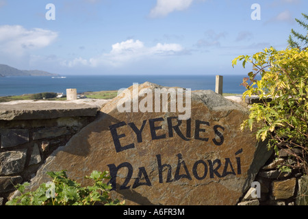 Eyeries village name sign in English and Gaelic On Ring of Beara route around Beara peninsula County Cork Eire Southern Ireland Stock Photo