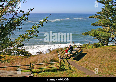 Couple whale watching in Cape Arago State Park near Coos Bay Oregon Stock Photo