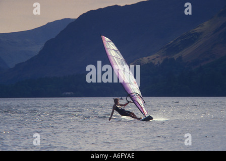 Female windsurfer on Derwent Water Cumbria England UK Stock Photo