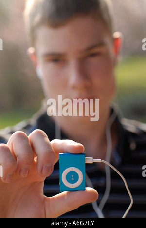 Teenie with Apple Ipod shuffle 2 Stock Photo