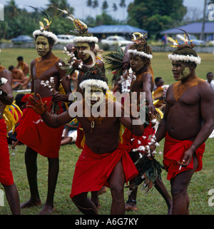 Group of male tribesmen with white feathered headdresses from Papua New Guinea at Festival of Pacific Arts in the South Pacific Stock Photo