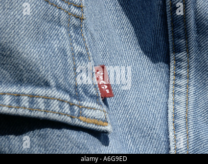 denim jeans levi s red tag blue washed pocket close stitching yellow worn  hang pants seam back rear fabric clothes Stock Photo - Alamy