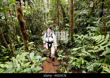 Woman with backpack in rainforest, Rara Avis, Las Horquetas, Costa Rica Stock Photo