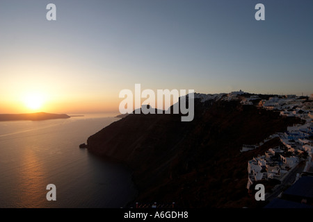 Sunset with sun setting into the Aegean sea Stock Photo