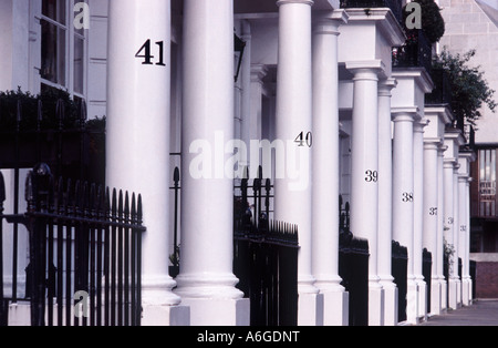 Black street address numbers on line of white columns before Regency homes, Thurloe Square, South Kensington, London SW7 England Stock Photo