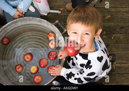 Boy apple bobbing Stock Photo