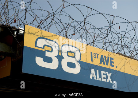 South Africa Johanesburg Alexandra Township panel in front of shop with barb wires for security Stock Photo