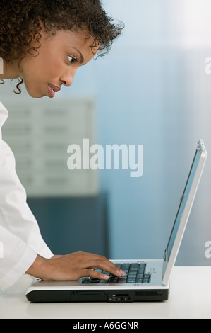 Doctor using laptop Stock Photo
