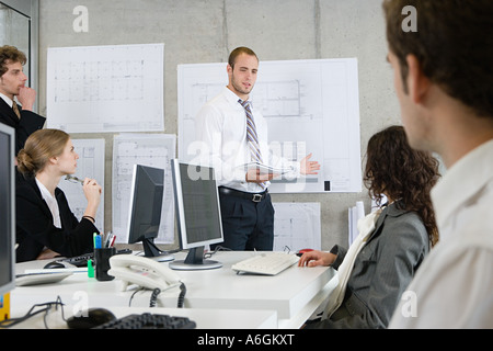 Man giving a presentation to colleagues Stock Photo
