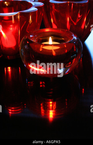 Romantic ambiance with Candle burning at night on table Stock Photo