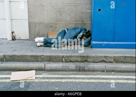 Homeless man sleeping rough in London UK Stock Photo