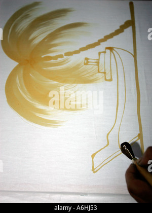 Batik artist applying wash away design Cherating Malaysia Stock Photo