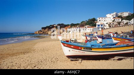 Portugal the Algarve Olhos de Agua fishing boats beach and landscape Stock Photo