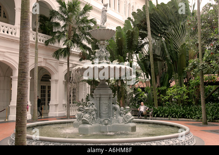 Ornate fountain in an inner courtyard Raffles Hotel Singapore Stock Photo