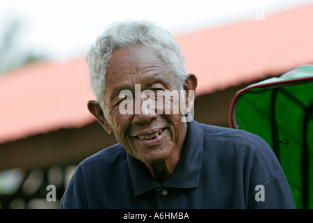 Rickshaw driver about 90 years old Kota Bharu Malaysia Stock Photo