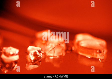 ice fragments on red background Stock Photo