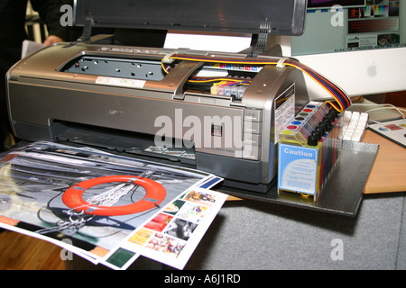 Close shot of cartridge replacement and supply pipes in a bulk ink supply system for inkjet printers. Stock Photo