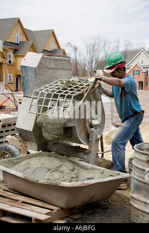 Immigrant Worker Mixing Mortar Building 4 Stock Photo
