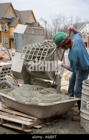 Immigrant Worker Mixing Mortar Building 4 Stock Photo