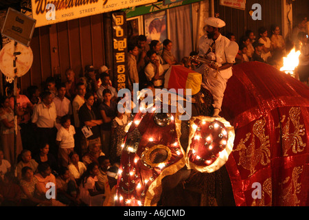 Man wearing a turban rides an elephant in the great Kandy Esala  Perahera  festival in Kandy, Sri Lanka Stock Photo