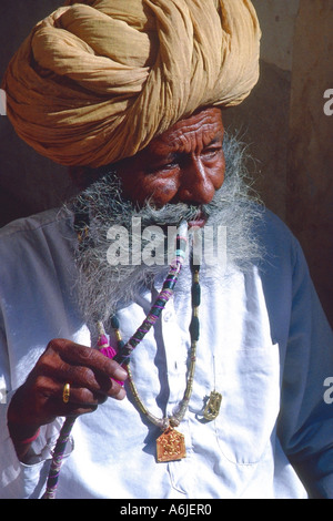 man from India with water pipe, India, Rajasthan, Jodhpur Stock Photo