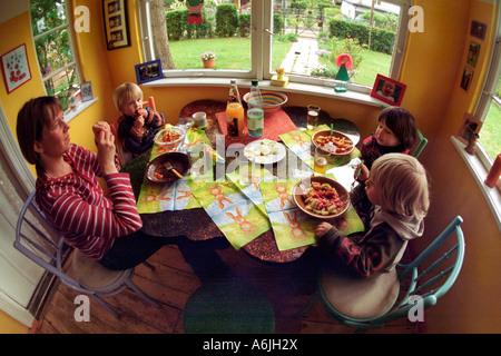 Mother and her children eating lunch, Berlin, Germany Stock Photo