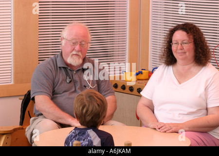 A medical doctor and a social worker work as a team to study a young patient with ADDHD in Newport VT Stock Photo