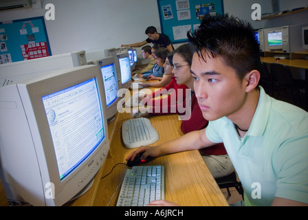 Oriental Korean Teenage 15-17 school computer class Multicultural senior teenage students studying at their work stations in school computer classroom Stock Photo
