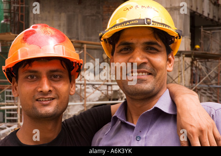 Construction workers pose for the camera in Kuala Lumpur, Malaysia. 2006 Stock Photo