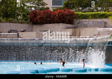 Kids swimming and playing in a pond at KLCC Park in Kuala Lumpur, Malaysia. 2006 Stock Photo