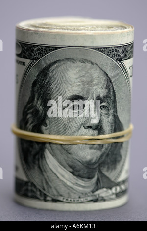 US currency roll of one hundred dollar bills close up Stock Photo