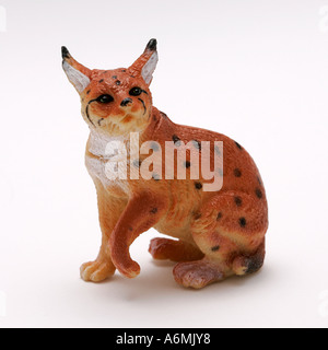 lynx felis lynx plastic toy wild animal colourful gray long legged cat with black ear tufts and a short tail tipped in black Stock Photo