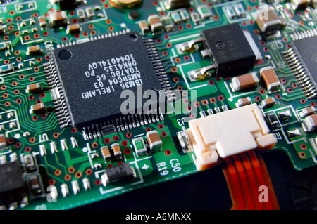 Micro chip and a connector on a circuit board Stock Photo
