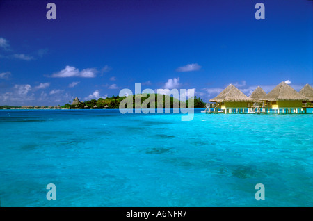 Shades of turquoise waters , thatched bungalows, Bora Bora Stock Photo