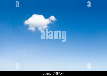 one single white soft fluffy cloud in blue sky shaped like an animal Stock Photo