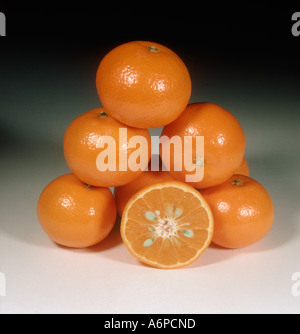 Group of mandarin fruit sectioned and whole variety Fairchild Stock Photo