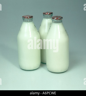Three full glass milk bottles Stock Photo